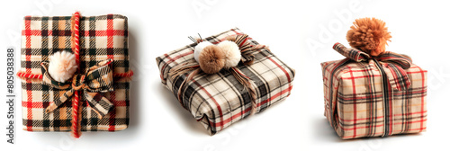 cozy gift box wrapped in plaid fabric with a fuzzy pom-pom bow on a white isolate background. photo