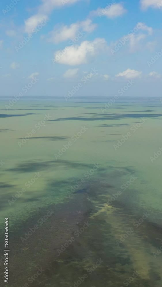 Open blue ocean with waves against the sky and clouds, top view. Summer and travel vacation concept. Open blue ocean with waves against the sky and clouds, top view. Summer and travel vacation concept.