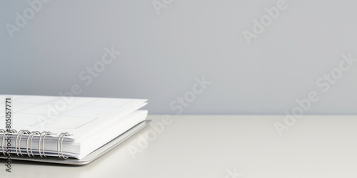 photo of calendar page flipping sheet on white table, light grey background, business schedule planning appointment meeting concept