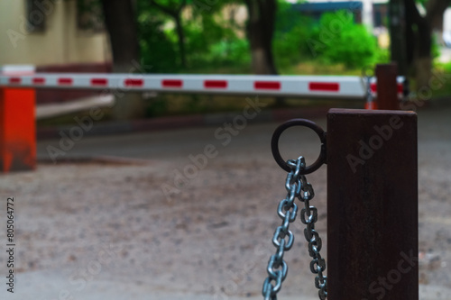Restrictions in the form of a red barrier and metal chains symbolize the abstract problems that humanity faces at all times of its life, compromises and agreements in overcoming crises and stagnation