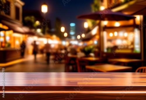 A wooden table with a blurred background of a restaurant at night