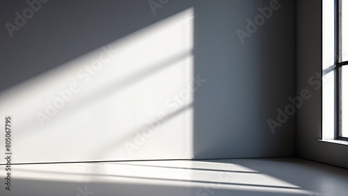 A minimalist interior with light from the window illuminating the interior of the room.