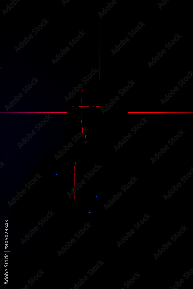 Shine a red laser in the shape of a cross at the girl. Future and virtual reality concept Shine a red laser in the shape of a cross at the girl. Future and virtual reality concept