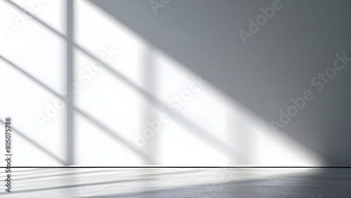 A minimalist interior with light from the window illuminating the interior of the room.