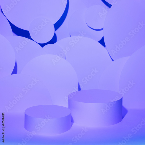 Abstract stage for presentation cosmetic products mockup - two round cylinder podiums in gradient purple violet glowing light, circles as geometric decor. Template for showing in neon hipster style.