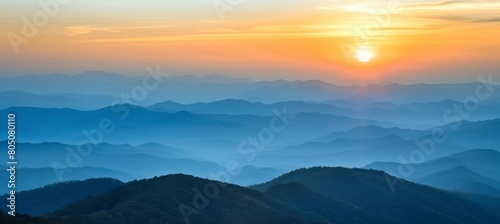 Golden hour stunning sunset casting warm hues over the majestic mountain landscape