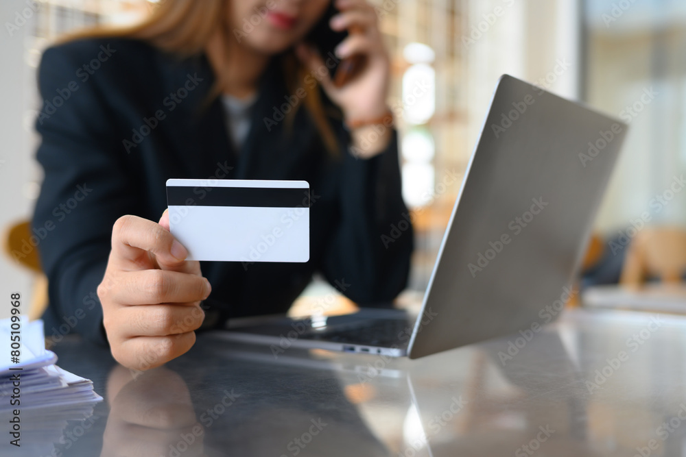 Select focus on woman holding credit card. Transactions, shopping online and finance concept Select focus on woman holding credit card. Transactions, shopping online and finance concept