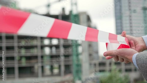 Experienced building contractor is cordoning off new construction zone photo