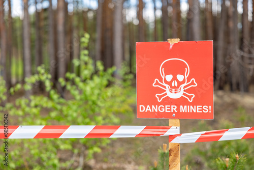 mine danger sign on a forest.