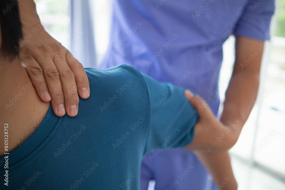 man was admitted for treatment of muscle pain in back of his shoulder due to working hard and causing muscle inflammation. doctor is treating man muscle pain in his back and shoulders due to overwork. man was admitted for treatment of muscle pain in back of his shoulder due to working hard and causing muscle inflammation. doctor is treating man muscle pain in his back and shoulders due to overwork.