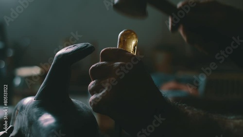 Hammering a screw driver into a saddle