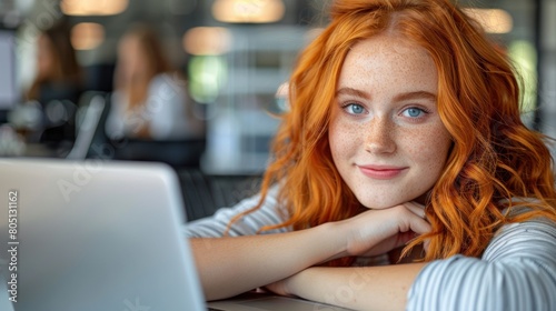 Woman With Red Hair Working on Laptop