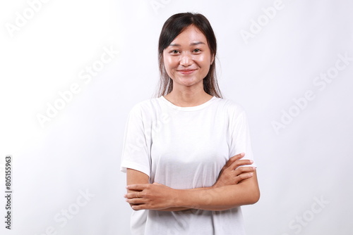 Portrait of young asian woman standing over white background
