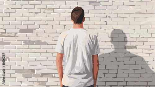 Man in stylish t-shirt near white brick wall background vie