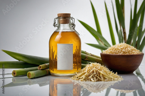 A jar of homemade sugarcane syrup surrounded by sugarcane stalks