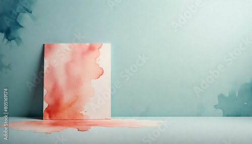 Canvas with watercolor abstract painting standing on a green and white gradient background in a studio