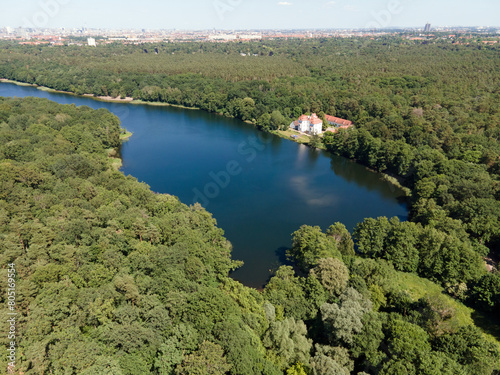 Aerial landscape of lake and Jagdschloss Grunewald in forest on a sunny summer day in Berlin