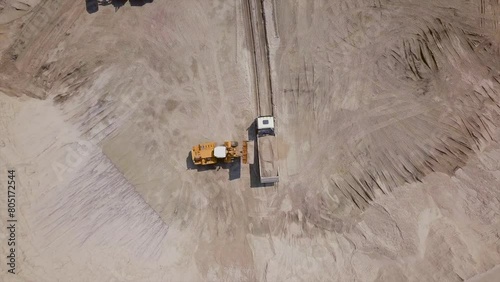 The work of loading equipment in the sand quarry
