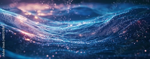Stunning visual of abstract, glowing blue waves with thousands of sparkling particles.