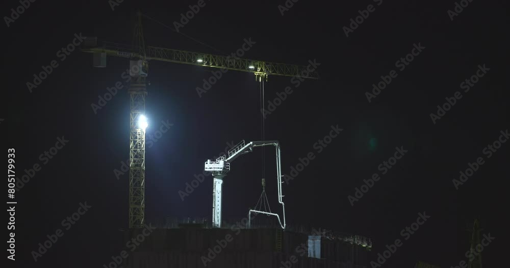 timelapse with construction site area. Development Multistorey Residential Building in night hours. timelapse time lapse Workers are engaged in repairing development on construction site. night time