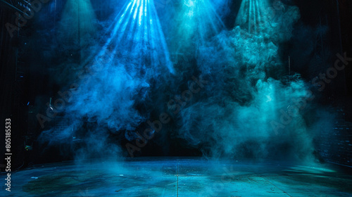 A stage with thick olive smoke under a sky blue spotlight  providing a deep  earthy contrast against a dark backdrop.