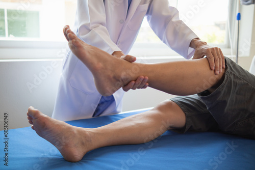 Doctors are examining patient muscle injuries and doing physical therapy for patient to move muscles so they can be used regularly because physical therapy will help strengthen muscles and blood flow.