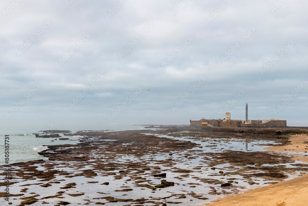 Obraz premium Castillo de San Sebastian a former island fortress in the city of Cadiz, Spain, now a destination for historical exhibits, concerts and other cultural events