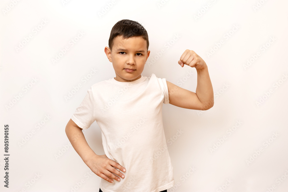 The guy strained his muscles, showing off his biceps. Healthy lifestyle and sports. The guy strained his muscles, showing off his biceps. Healthy lifestyle and sports.