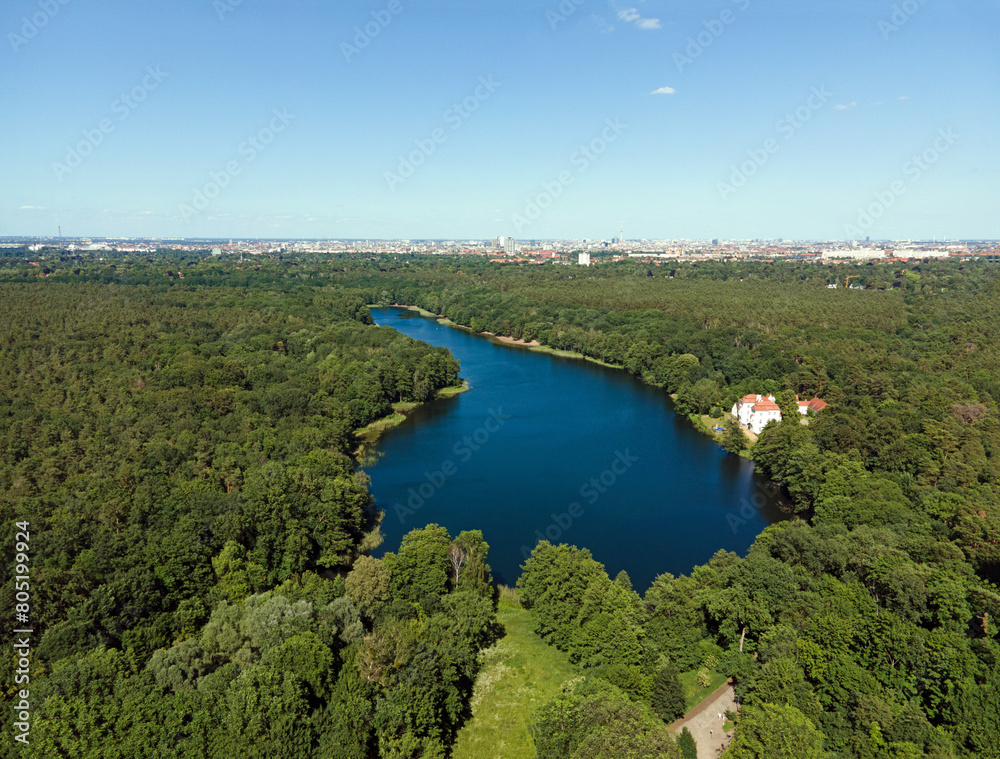 Aerial landscape of lake and Jagdschloss Grunewald in forest on a sunny summer day in Berlin