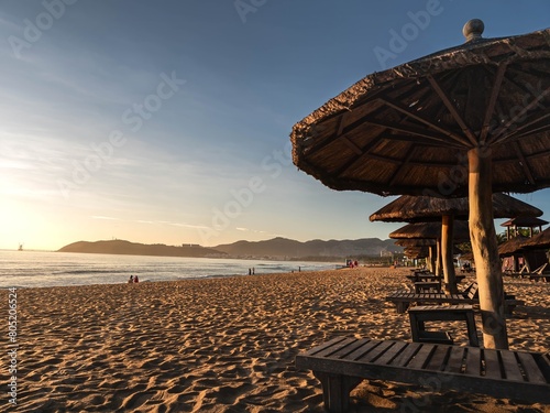 Straw umbrellas on vacation beaches