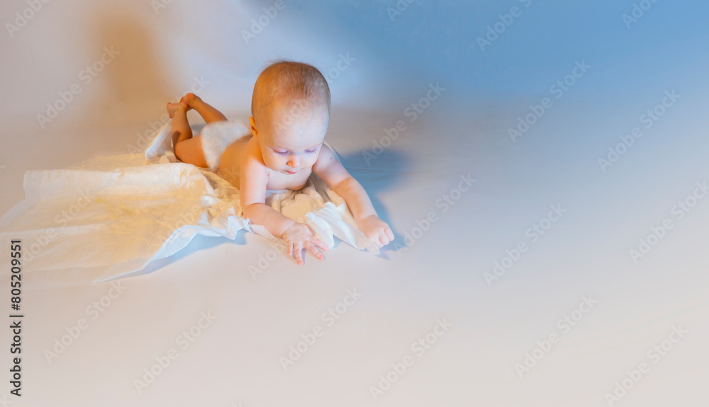 a baby with a hemangioma on his neck lies on a white background. banner with a copy space. a child on a disposable diaper. purity
