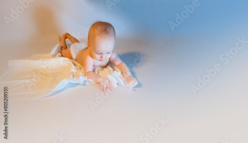 Obraz na płótnie a baby with a hemangioma on his neck lies on a white background. banner with a copy space. a child on a disposable diaper. purity w salonie
