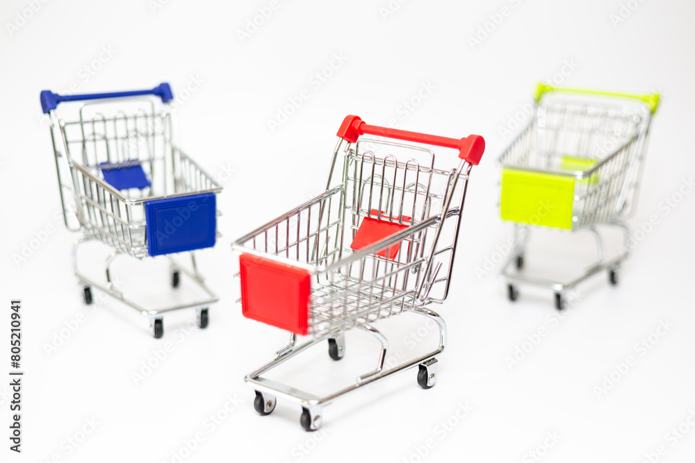 Toy shopping carts. Toy shopping trolleys on white background. Toy shopping carts. Toy shopping trolleys on white background.