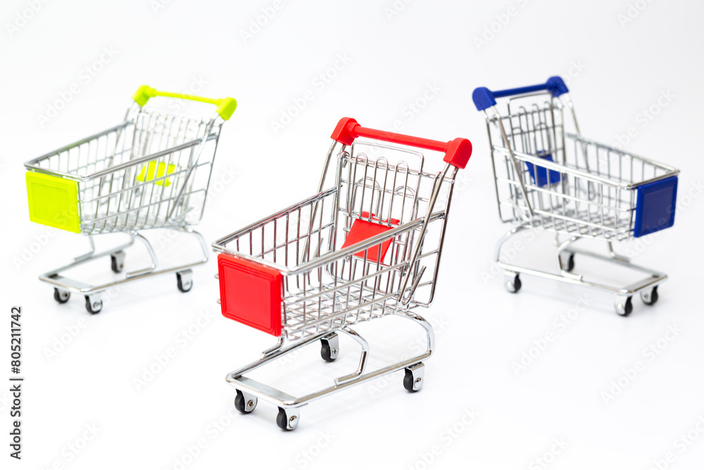 Toy shopping carts. Empty toy shopping trolleys on white background.