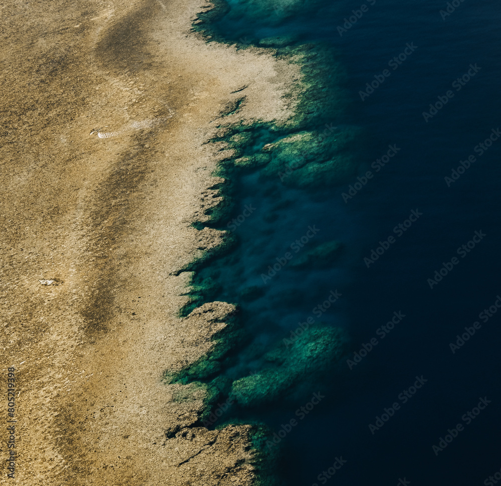 Aerial view of Great Barrier Reef coral reef structure in Whitsundays, Aerilie beach, Queensland, Australia