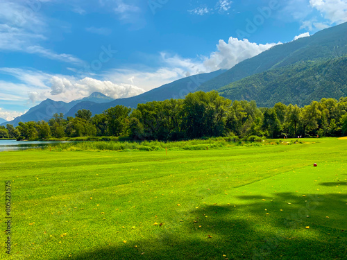Wallpaper Mural Golf Course with Mountain View and Clouds in a Sunny Summer Day in Granges, Valais in Switzerland. Torontodigital.ca