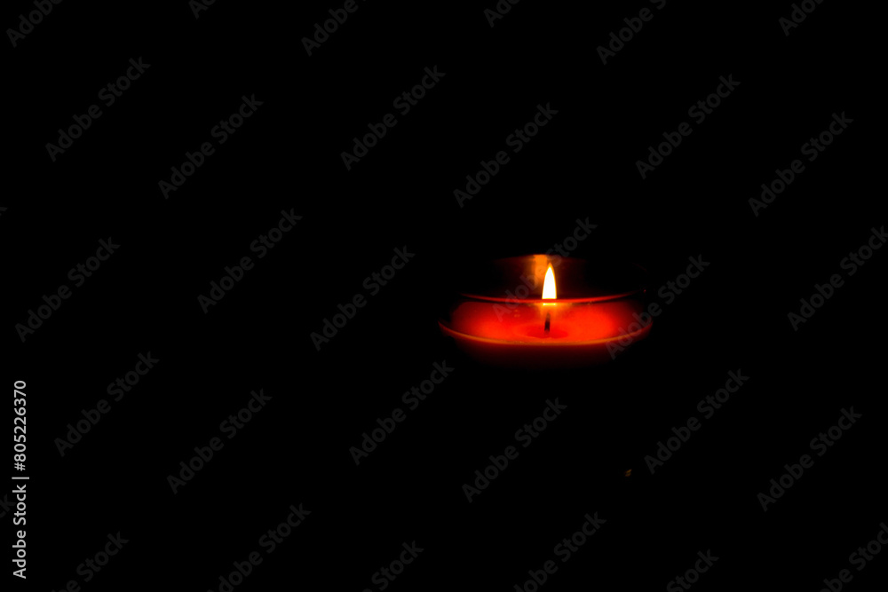 one candle in a dark place for festivals or religions