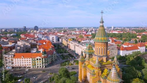Aerial view of the beautiful city of Timisoara, Romania. Footage was shot from a drone at a higher altitude with the Mitropolitan Cathedral and The Victory Square in the view. photo