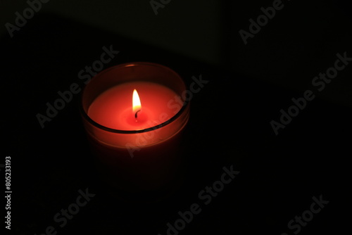 one candle in a dark place for festivals or religions