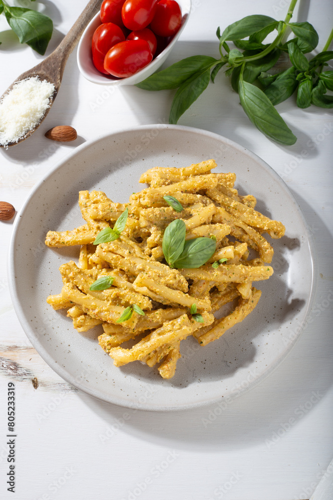 Sicilian pasta with almond and tomatoes pesto. Typical Italian food from Sicily. Food suitable for vegetarians. Sicilian pasta with almond and tomatoes pesto. Typical Italian food from Sicily. Food suitable for vegetarians.