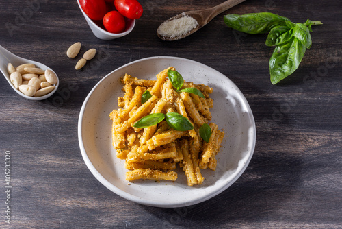 Sicilian pasta with almond and tomatoes pesto. Typical Italian food from Sicily, pasta with red pesto.