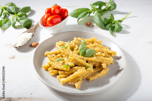 Sicilian pasta with almond and tomatoes pesto. Typical Italian food from Sicily. Food suitable for vegetarians.