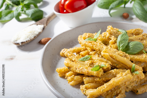 Sicilian pasta with almond and tomatoes pesto. Typical Italian food from Sicily. Food suitable for vegetarians.