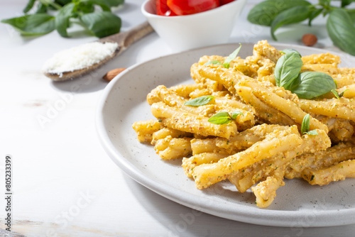 Sicilian pasta with almond and tomatoes pesto. Typical Italian food from Sicily. Food suitable for vegetarians.