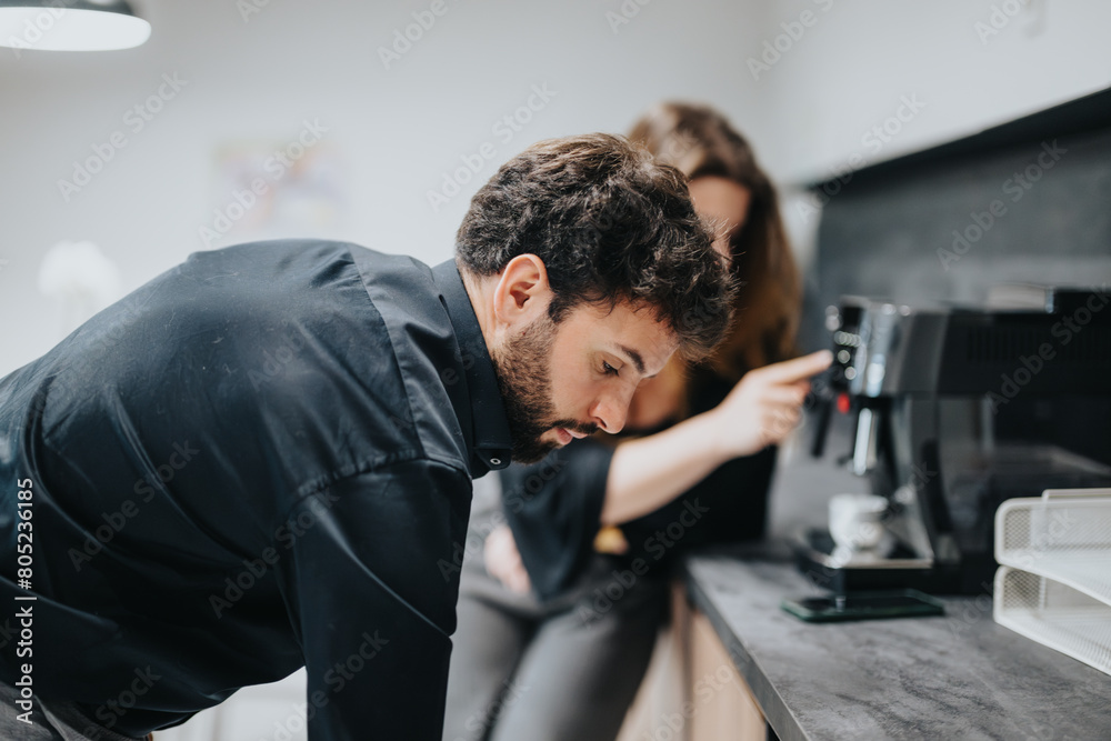 A man and woman, dressed in business casual, share a light moment during a coffee break in a modern office kitchen. A man and woman, dressed in business casual, share a light moment during a coffee break in a modern office kitchen.