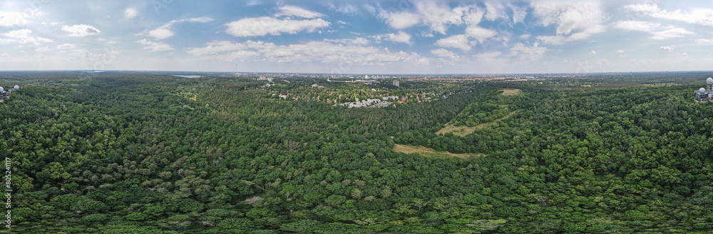 Aerial landscape of Grunewald forest and city skyline on a sunny day in Berlin