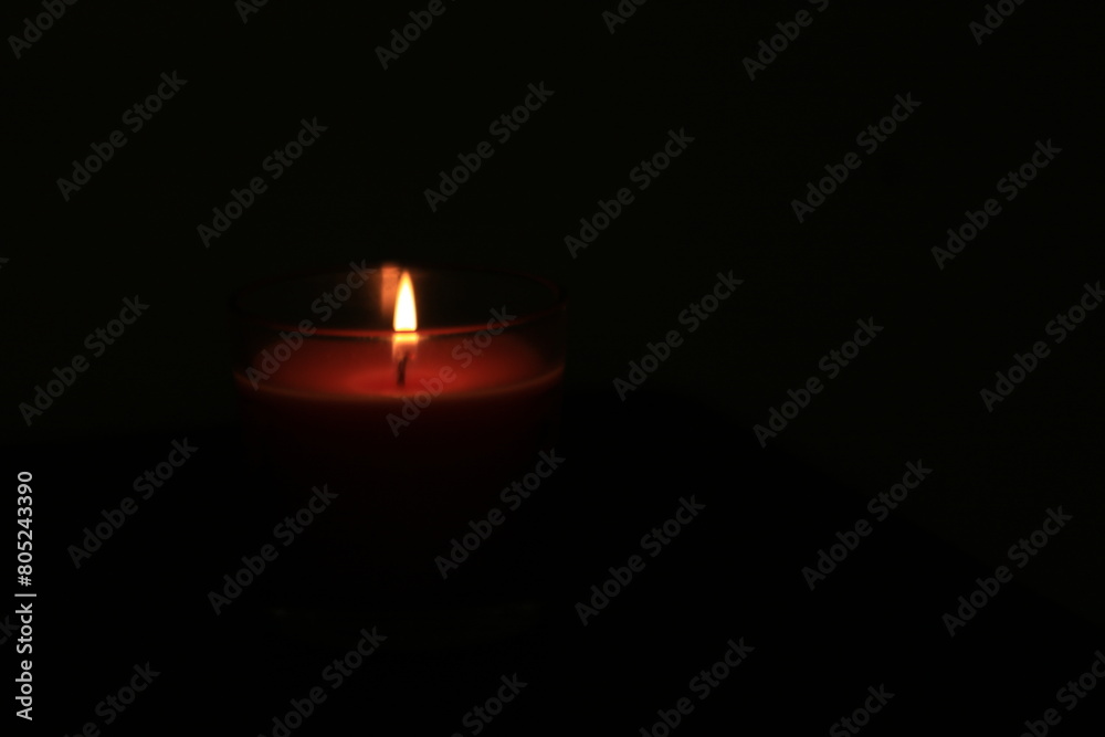 one candle in a dark place for festivals or religions one candle in a dark place for festivals or religions