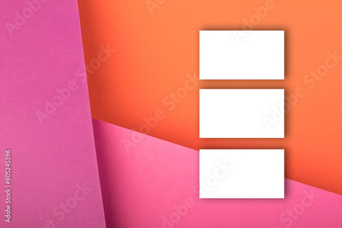 Business card blank over colorful background. Copy space for text. Top view.Business card blank over colorful abstract background. Corporate stationery branding mock-up. Copy space for text. Top view.