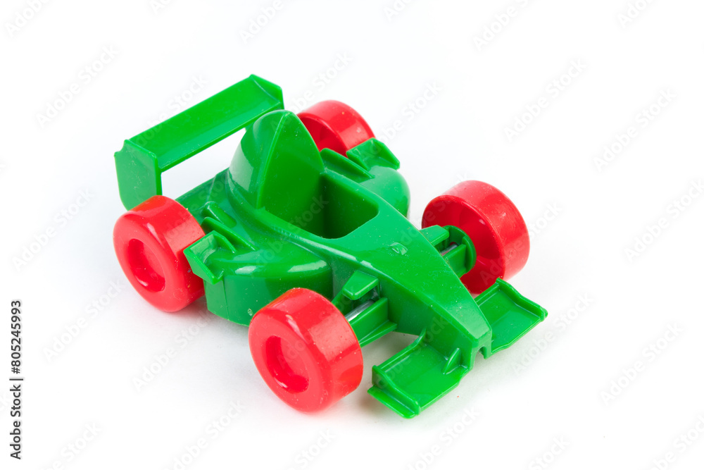 Naklejka premium toy motor racing car, for children's fun and play, front closeup view, isolated on white background. For the development of the child.