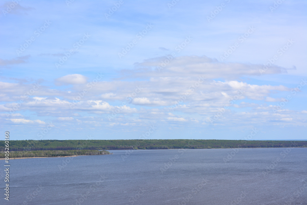 the Volga river with a few clouds in the sky copy space